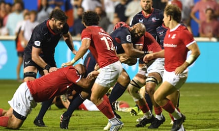 Paul Lasike of the USA is tackled during the RWC 2023 Final Qualification Tournament match against Portugal in Dubai last month.