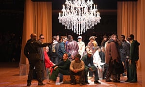 Models gathered under chandelier with Abloh, wearing sunglasses
