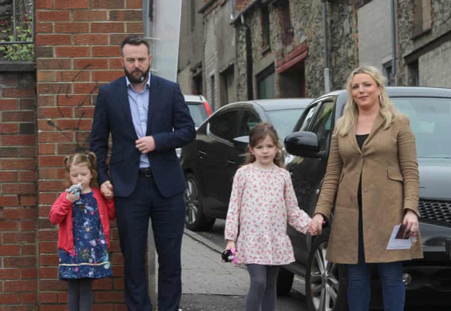 The SDLP leader, Colum Eastwood, arrives to cast his vote in the Foyle constituency in Derry, with his wife, Rachael, and children, Rosa, six, and Maya, four.