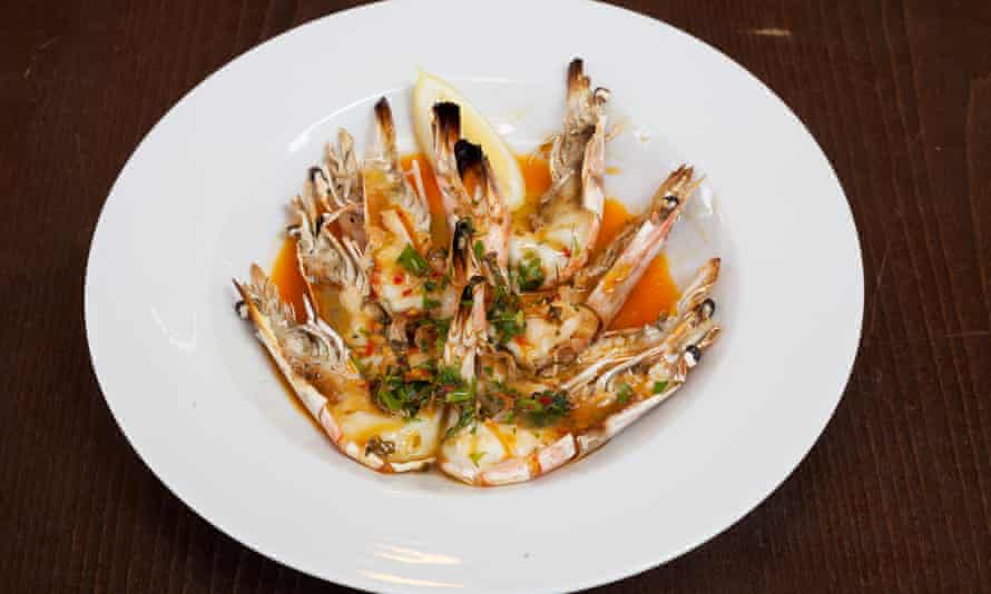 ‘Split open and generously smothered’: grilled prawns and piri piri sauce.