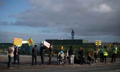 Protesters stand outside Cuadrilla’s Preston New Road fracking site near Blackpool, Lancashire.