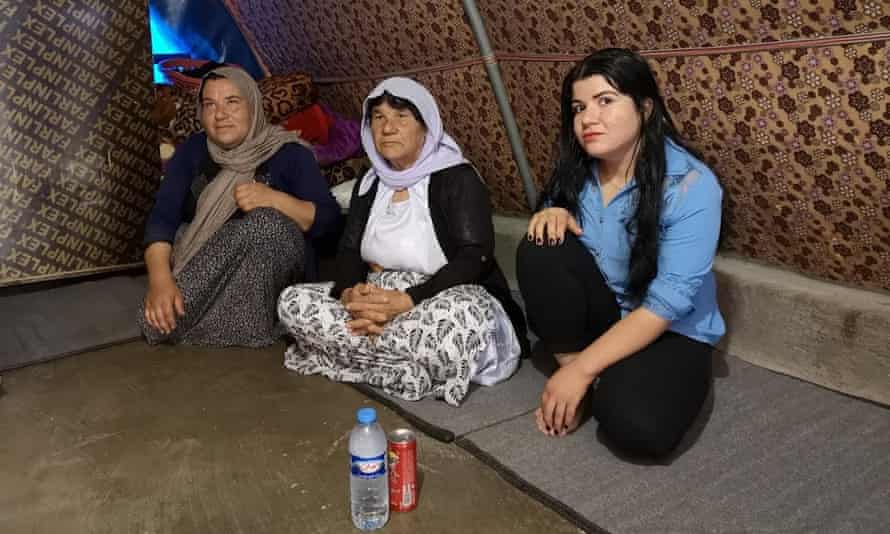 Rainas Elias, with her mother and grandmother in their tent in Khanke IDP camp near Dohuk