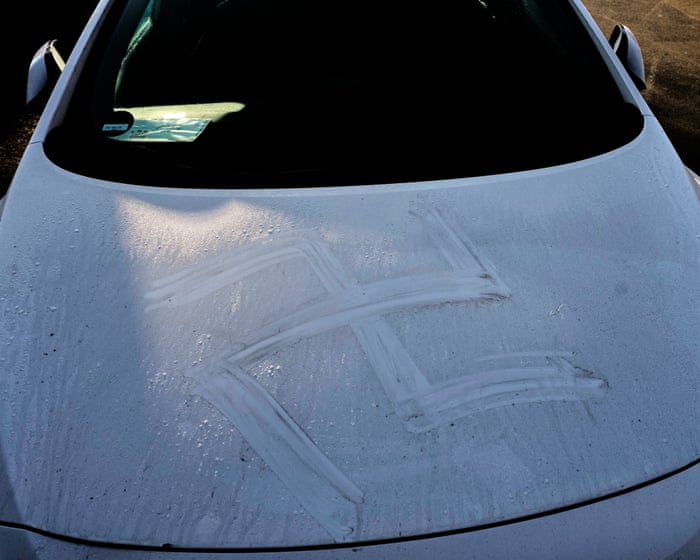 German police detain man suspected of painting swastikas on cars and walls with his own blood – as it happened