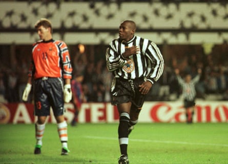 Faustino Asprilla gestures to the Newcatsle fans after scoring past Barcelona’s Barcelona’s Ruud Hesp from the penalty spot to complete his hat-trick.