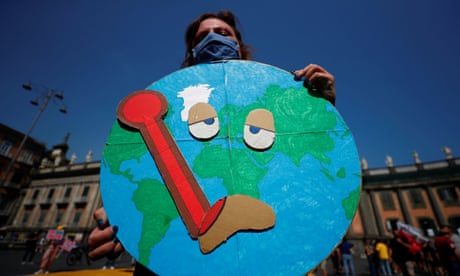 A climate activist protests on 22 July as G20 ministers meet in Naples.