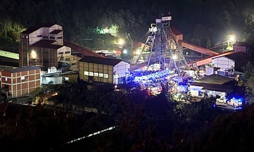 Ambulances and firefighters arrive at the site of the coalmine.