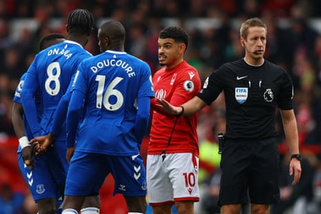 Gueye, Onana and Doucoure talk to Gibbs-White as referee John Brooks looks on.