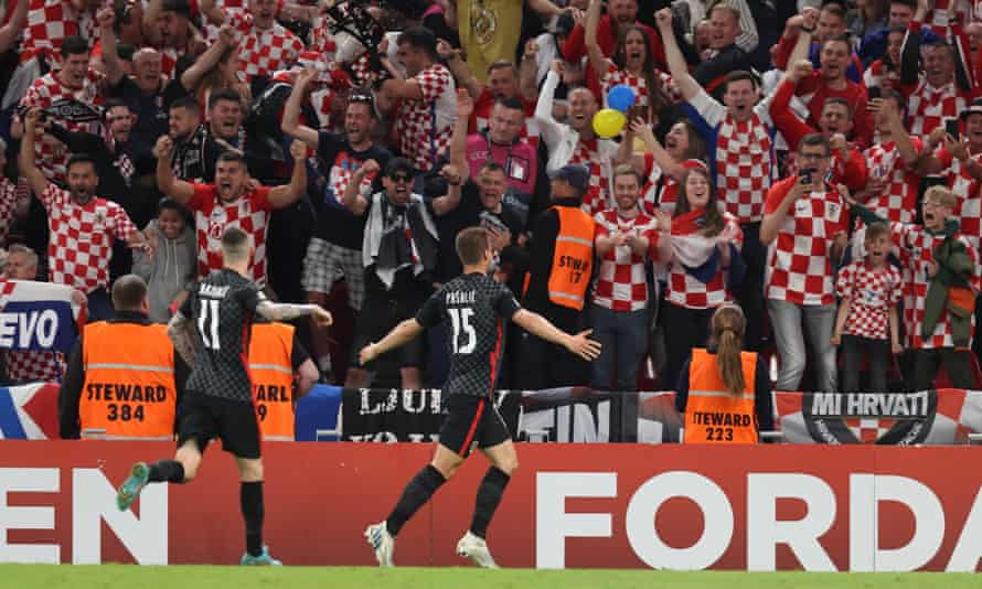 Nations League: Kylian Mbappé rescues draw for France against Austria | Nations League 3 Mario Pasalic celebrates with the away fans at Parken Stadium