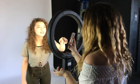 Social media students December Ensminger, left, and Brooke Alyse experiment with lights and cameras at an LA film studio.