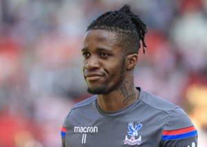 The in-form Wilfried Zaha warms up.