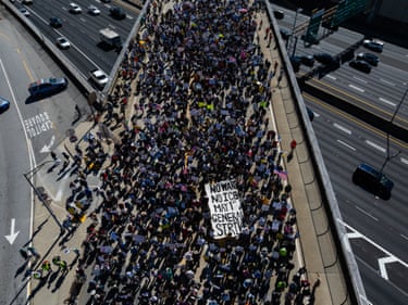 AtlantaAn aerial view shows people marching near the Georgia state capitol building.