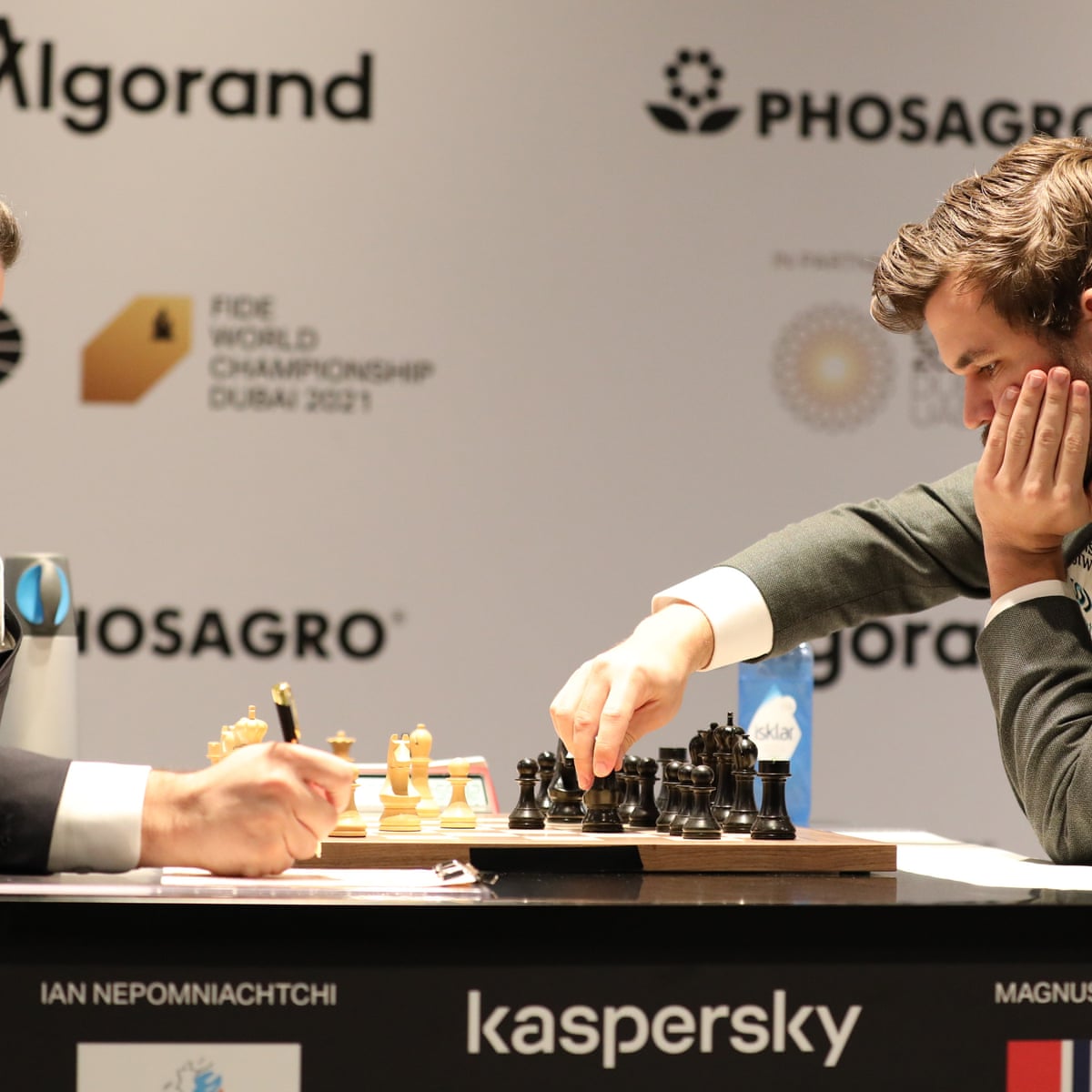 Carlsen and Nepomniachtchi draw chess world title opener after flag furore, World Chess Championship 2021