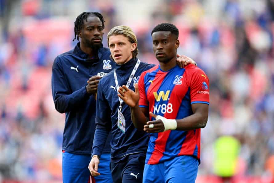 Conor Gallagher embraces Marc Guehi of Crystal Palace after their sides defeat.