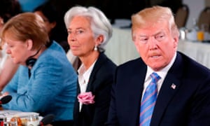 Trump attends a G7 and Gender Equality Advisory Council meeting on 9 June, with IMF Managing Director Christine Lagarde and German Chancellor Angela Merkel