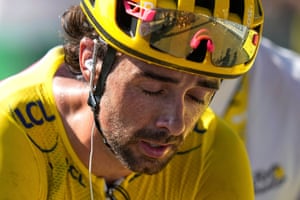 Ben Healy crosses the finish line after losing his overall leader’s yellow jersey.