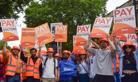 Junior doctors outside Downing Street as they begin their latest strike over pay on 27 June.