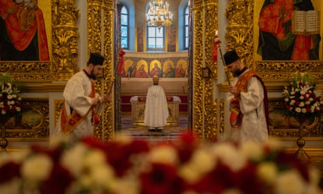An Orthodox priest recites the prayer in Kyiv Pechersk Lavra before the Easter Sunday mass