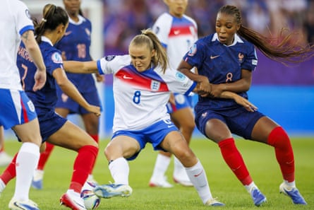 Georgia Stanway tussles with Grace Geyoro.