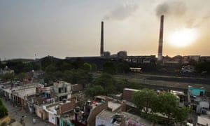 Emissions billow from smokestacks at a coal-fired power plant in Badarpur, Delhi, India
