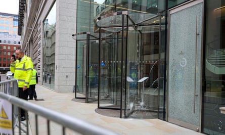 Broken panes of glass at the offices of JP Morgan