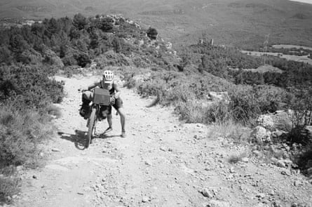 Anna pushing the bike in Catalonia, Spain