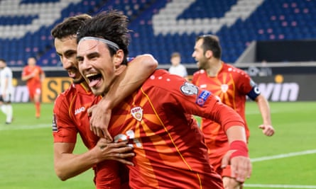 Eljif Elmas is congratulated after scoring North Macedonia’s winner away to Germany, with Goran Pandev wearing the captain’s armband in the background