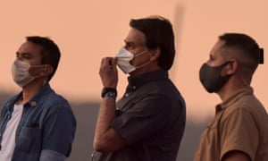 Jair Bolsonaro attends a ceremony of lowering the flag, at the Alvorada Palace in Brasilia in Monday.