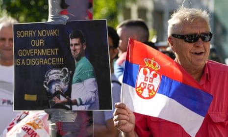 A supporter of Serbian tennis player Novak Djokovic rallies outside the Park hotel in Melbourne where the world No 1 is being held ahead of his court challenge.