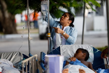 A nurse works outside Hospital Aquilino Tejeira after an evacuation following the 7.7-magnitude earthquake in Penonome, Panama