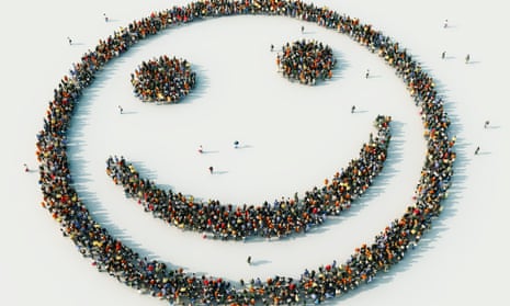 Aerial view of crowd of people arranged in smiley face
