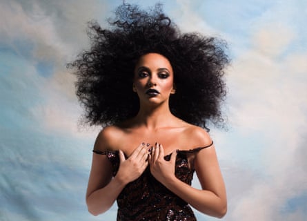 Little Mix singer Jade Thirlwall dressed as Diana Ross, against a sky-painted backdrop