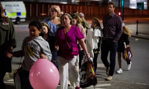 Police leading parents and their children away from arena