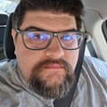 a man sits in a car