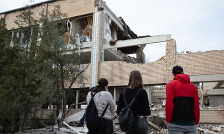 Ukrainian students outside a school building attacked by Russian drones