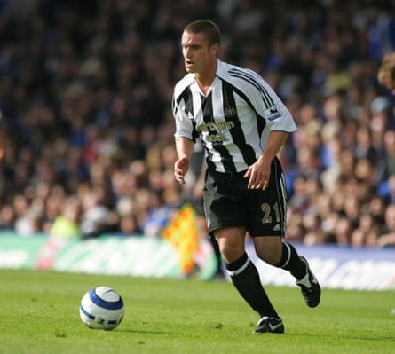 Lee Clark successful a Newcastle kit dribbling a football