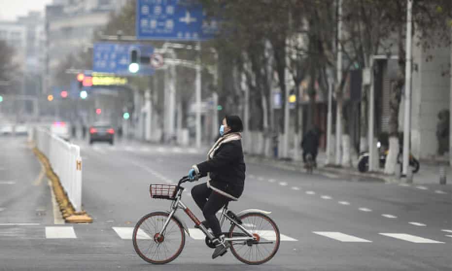 Cyclist in Wuhan, China, 27 January 2020.