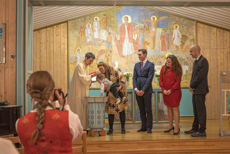 Siv Limstrand baptizes a baby