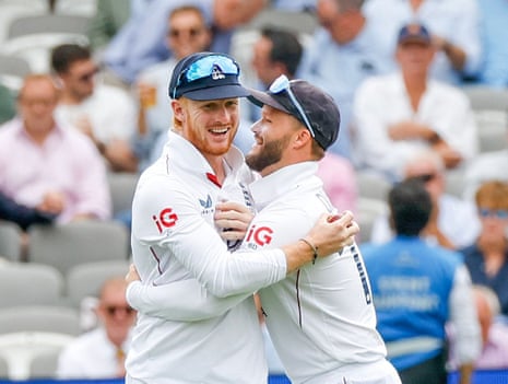 Jordan Cox (left) gets a hug from England teammate Ben Duckett after catching Babar Azam