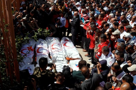 Palestinians mourn medics who came under Israeli fire while on a rescue mission, in Khan Younis in Gaza.