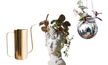 A brass watering can, a Grecian-bust plant pot and a disco-ball hanging basket