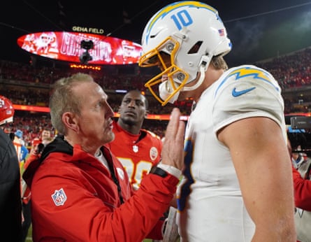 Kansas City Chiefs defensive coordinator Steve Spagnuolo offer words of encouragement to Los Angeles Chargers quarterback Justin Herbert after Sunday’s game.
