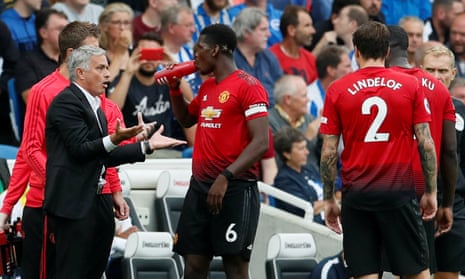 José Mourinho talks with Paul Pogba during Manchester United’s 3-2 defeat by Brighton.
