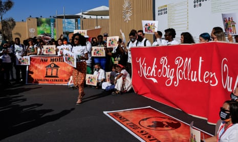 Climate activists protest against big polluters at the Sharm El-Sheikh International Convention Centre.