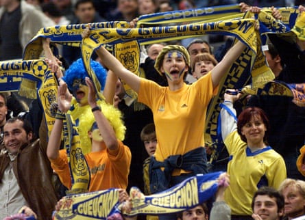 Gueugnon fans support their team during the French league soccer final against Paris Saint Germain at Paris’s Stade de France in April 2000.