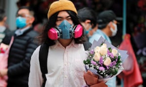 A man wears a gas mask in Hong Kong, China