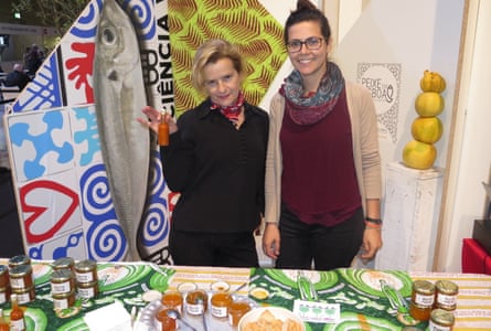 Good writer Adriana Freire, left, sells jam made from the city’s fruit trees on her Muita Fruita stall in Lisbon