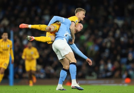Manchester City’s Erling Haaland clashes with Jan Paul van Hecke.