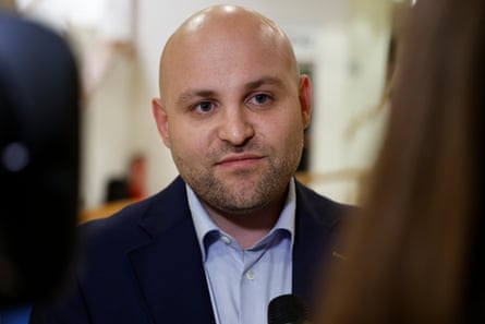 Markus Frohnmaier, AfD candidate, speaks into a microphone during a TV interview