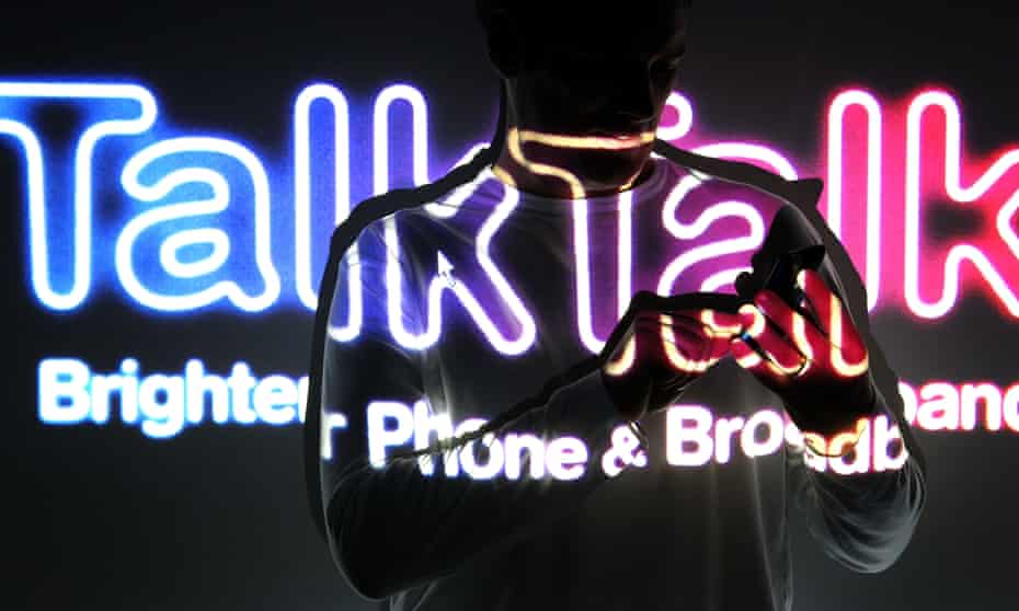 TalkTalk logo behind a person using a phone