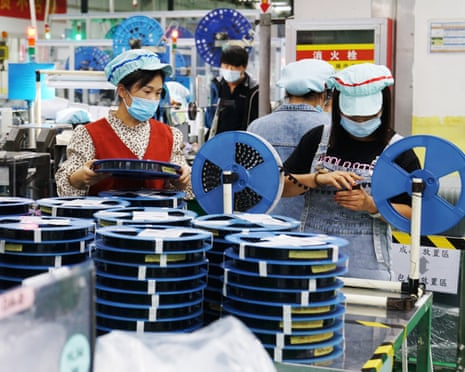 Employees work at a Foxconn factory in 2021 in Zhengzhou, Henan Province of China.